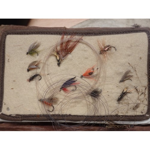 815 - A paper Rig Wallet containing approximately twenty Salmon and Sea Trout Flies, an old leather Fly Wa... 