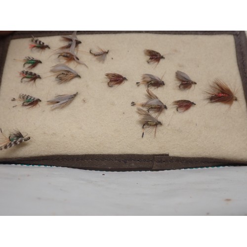 815 - A paper Rig Wallet containing approximately twenty Salmon and Sea Trout Flies, an old leather Fly Wa... 