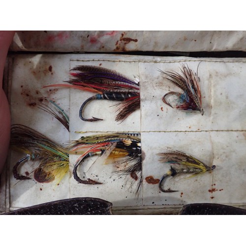 814 - An old leather Fly Wallet containing a quantity of old Salmon Flies in varying conditions, a W.J. Cu... 