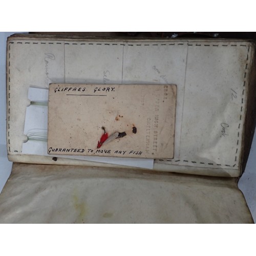 814 - An old leather Fly Wallet containing a quantity of old Salmon Flies in varying conditions, a W.J. Cu... 