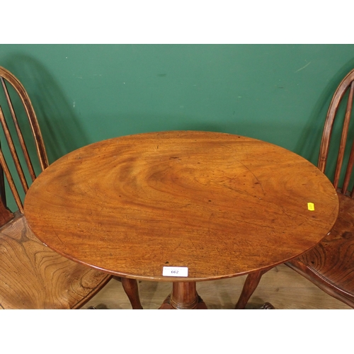 66 - A mahogany oval Tripod Table A/F and an oak rush seated Stool.