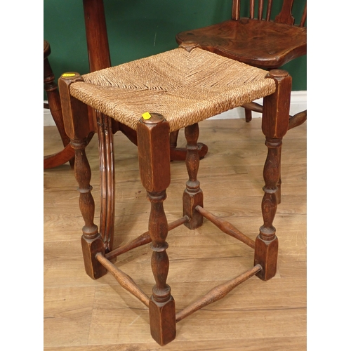 66 - A mahogany oval Tripod Table A/F and an oak rush seated Stool.