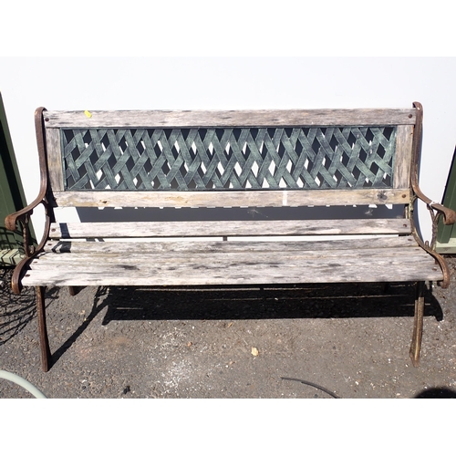 705 - A small garden Bench with lattice work decoration