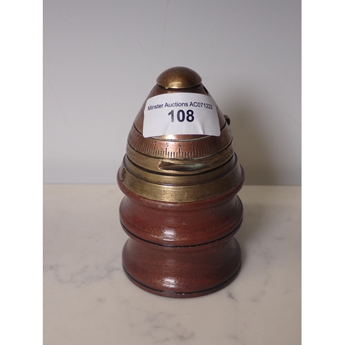 108 - A WWI ballistic Shell Timer mounted on teak as a paperweight