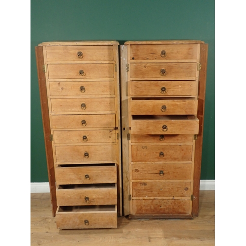 12 - A pair of pine Wellington style Chests, each having ten drawers, 4ft 7in H x 1ft 9in W