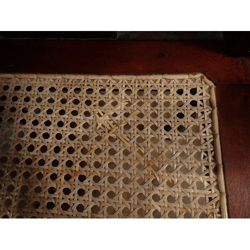 124 - A carved mahogany Corner Chair with cane seat and an oak Sutherland Table