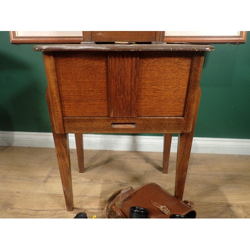 129 - An oak Sewing Table, an oak Mantel Clock, a Strongbow Print and two pairs of Binoculars