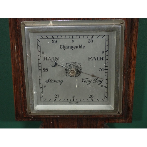 131 - A Chinese blue and white Stick Stand and an oak aneroid Barometer