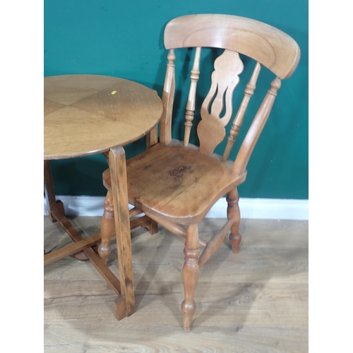 134 - A circular Table and a pair of Kitchen Chairs