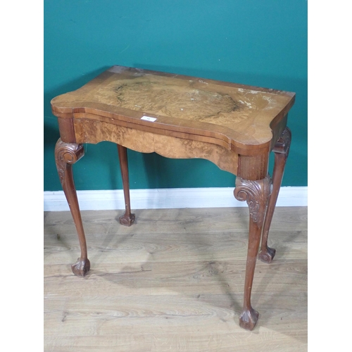 14 - A reproduction walnut fold-over Card Table and a French style upholstered Armchair