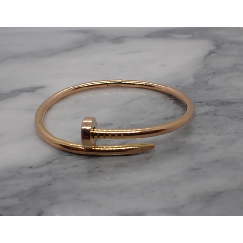 171 - A Cartier 'Juste un Clou' hinged Bracelet in 18ct rose gold, signed Cartier 17 EXA258 in original bo... 