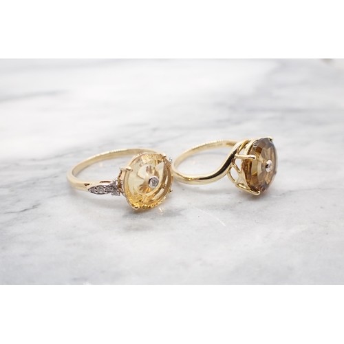 195 - Two Glen Lehrer 'Torus' Rings each with central brilliant-cut diamond in 9ct gold, yellow stone ring... 