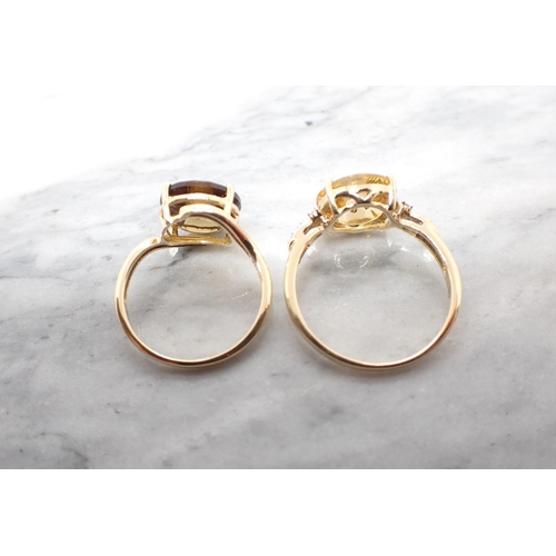 195 - Two Glen Lehrer 'Torus' Rings each with central brilliant-cut diamond in 9ct gold, yellow stone ring... 