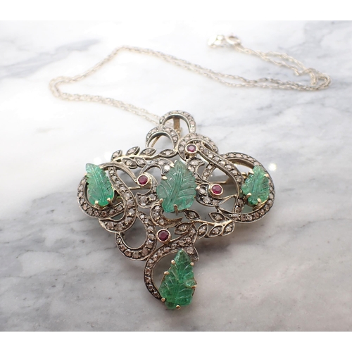 201 - An Emerald, Ruby and Diamond Pendant/Brooch the asymmetric openwork plaque claw-set four emeralds ca... 