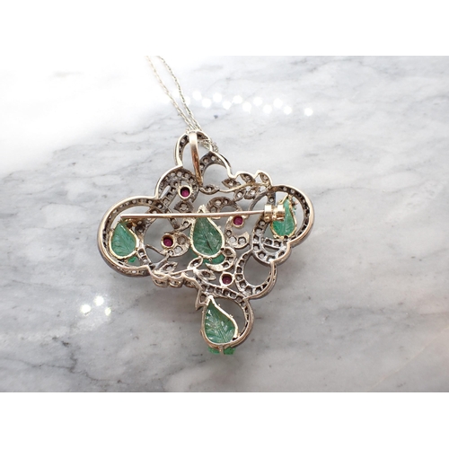 201 - An Emerald, Ruby and Diamond Pendant/Brooch the asymmetric openwork plaque claw-set four emeralds ca... 