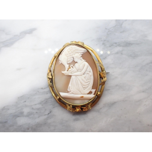 203 - A carved shell Cameo Brooch of Leda and the Swan in pinchbeck frame