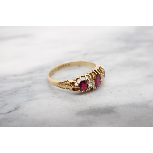 205 - A Ruby and Diamond five stone Ring three graduated oval-cut rubies with two old-cut diamonds between... 