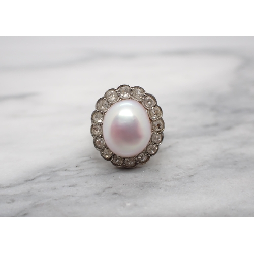 207 - A Cultured Pearl and Diamond Cluster Ring set pale pink pearl within a frame millegrain-set old-cut ... 