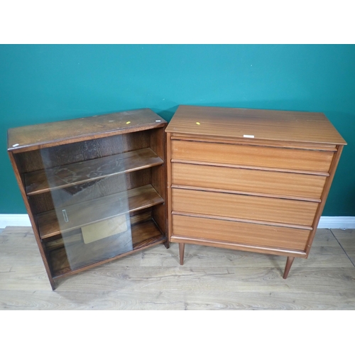 27 - A modern oak Bookcase with sliding doors and a modern Chest of drawers