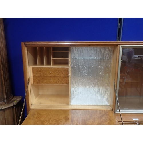 309 - An Art Deco walnut veneered Unit with glazed upper section above two drawers and two cupboard doors ... 