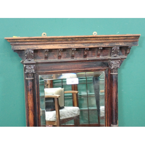 32 - A Wall Mirror with bevelled glass flanked by Corinthian columns 3ft 2in H x 1ft 8in W