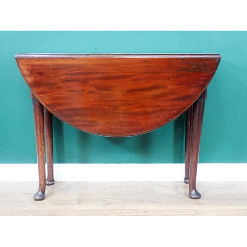 33 - A mahogany dropleaf Table with oval top on turned supports and pad feet, 3ft 5in open x 3ft 2in