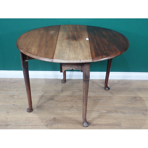 33 - A mahogany dropleaf Table with oval top on turned supports and pad feet, 3ft 5in open x 3ft 2in