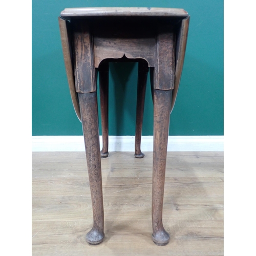 33 - A mahogany dropleaf Table with oval top on turned supports and pad feet, 3ft 5in open x 3ft 2in