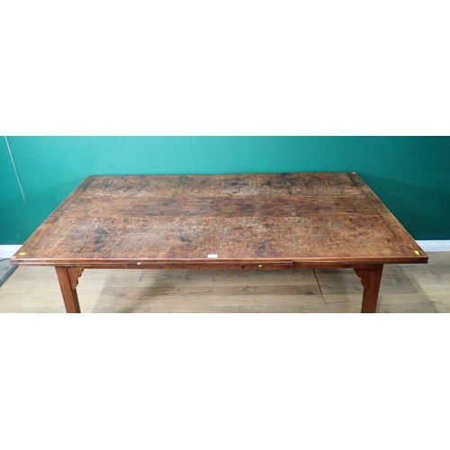 340 - A fruitwood draw leaf Refectory Table mounted on square cut tapering supports made by J.L. Browns 6f... 