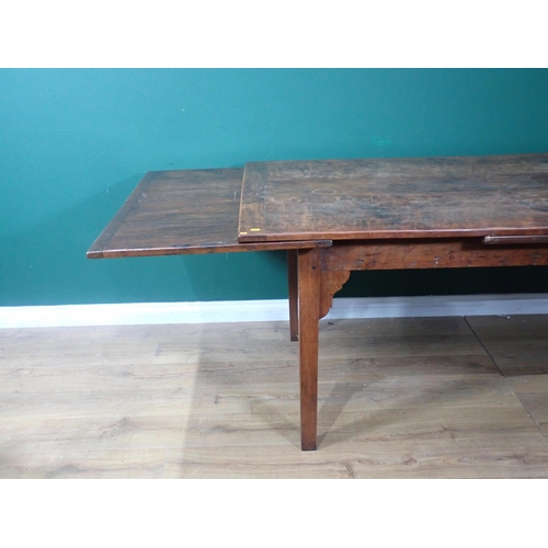 340 - A fruitwood draw leaf Refectory Table mounted on square cut tapering supports made by J.L. Browns 6f... 