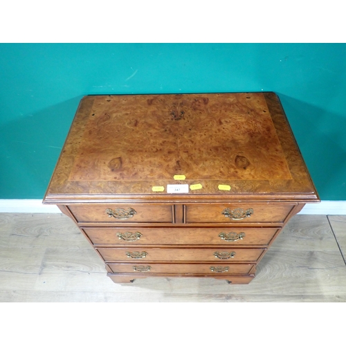 347 - A reproduction burr walnut Chest of two short, three long drawers on bracket feet. 2ft 4in H x 2ft W... 