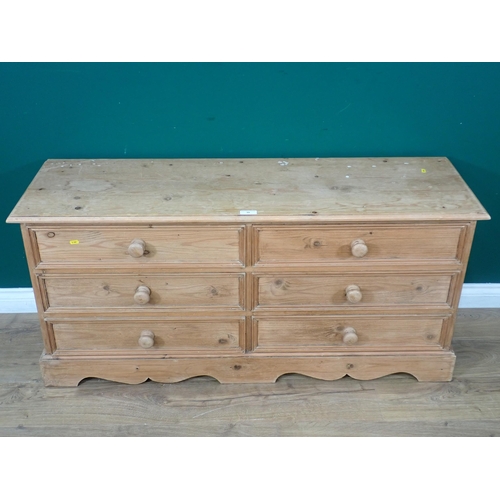 35 - A low pine Chest of six drawers with shaped base, 4ft 4in W x 2ft H x 1ft 4in deep