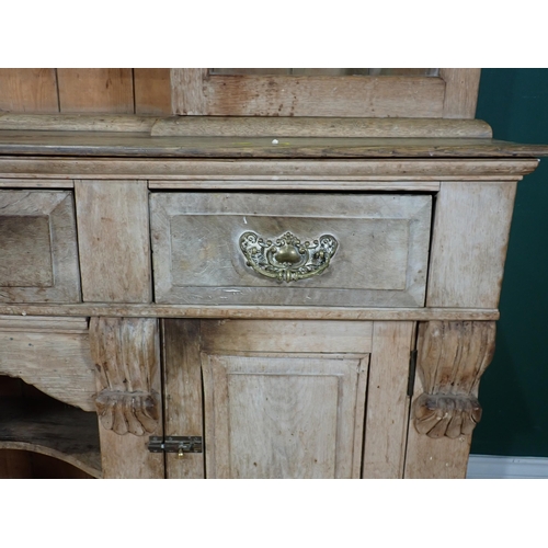 350 - A Victorian limed oak Dresser and Rack fitted three frieze drawers above pair of cupboard doors flan... 