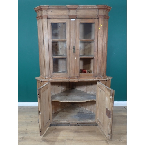 355 - An antique Continental standing Corner Cupboard fitted glazed doors to upper section 6ft 2in H x 4ft... 