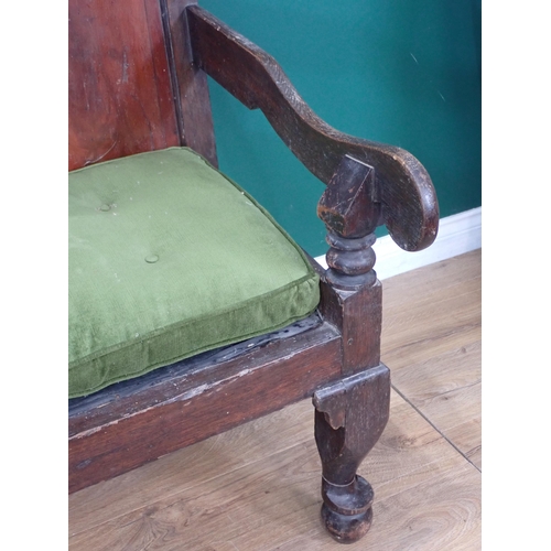 37 - An 18th Century and later oak Settle with fielded mahogany panel back mounted on cabriole front supp... 