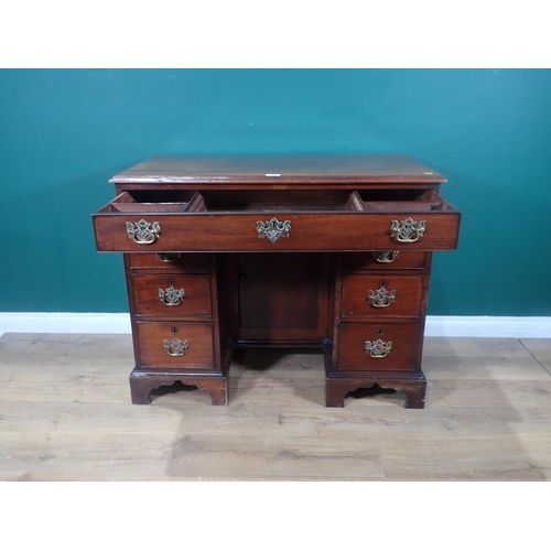 372 - A Georgian mahogany kneehole Desk fitted single frieze drawers and six drawers to pedestals mounted ... 