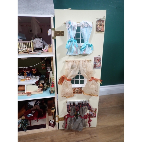 394 - A modern Doll's House with Dolls and Furniture 2ft 8in H x 2ft 4in W