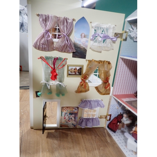 394 - A modern Doll's House with Dolls and Furniture 2ft 8in H x 2ft 4in W