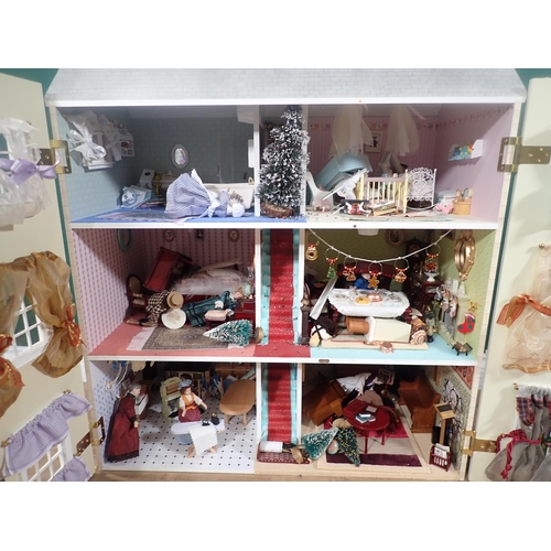 394 - A modern Doll's House with Dolls and Furniture 2ft 8in H x 2ft 4in W