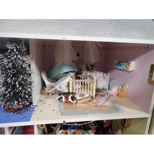 394 - A modern Doll's House with Dolls and Furniture 2ft 8in H x 2ft 4in W