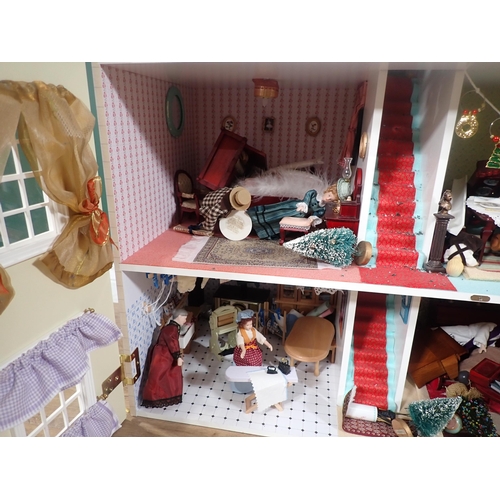 394 - A modern Doll's House with Dolls and Furniture 2ft 8in H x 2ft 4in W