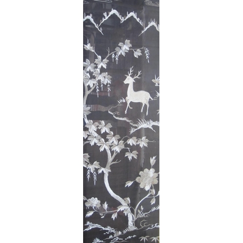 409 - CHINESE SCHOOL, 20th Century. The Foo Dog and The Deer, embroidered panels, 24 x 67in; a pair (2)