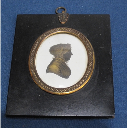 413 - ENGLISH SCHOOL, c.1820. Portrait silhouette of a lady, bust-length, wearing blouse and mob cap, oval... 