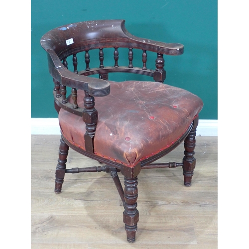 46 - A 19th Century mahogany Smoker's Bow Armchair with leather cushioned seat (A/F) on turned supports a... 