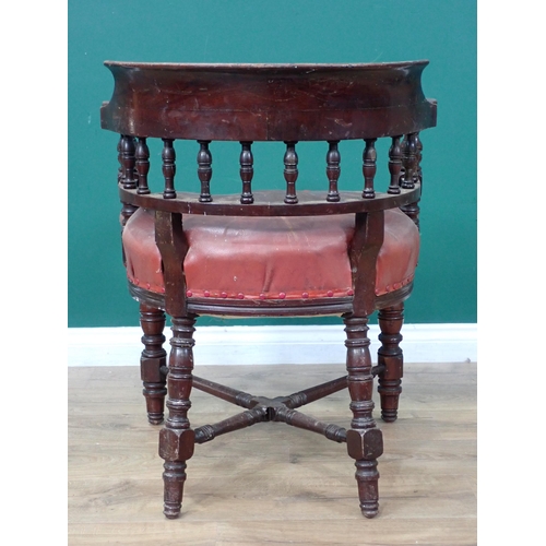 46 - A 19th Century mahogany Smoker's Bow Armchair with leather cushioned seat (A/F) on turned supports a... 