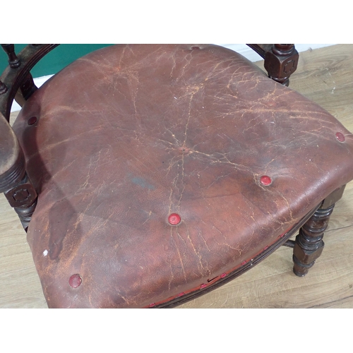 46 - A 19th Century mahogany Smoker's Bow Armchair with leather cushioned seat (A/F) on turned supports a... 