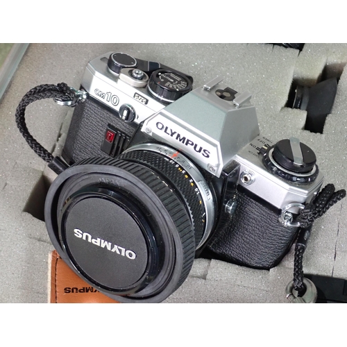 460 - An Olympus OM10 35mm Camera Outfit including various lenses, motor drive, flash in a hard case and a... 