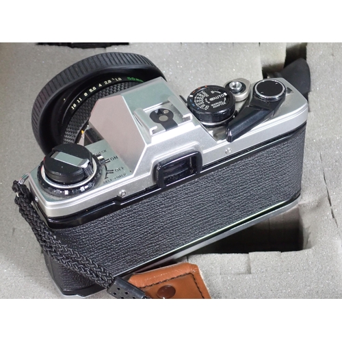 460 - An Olympus OM10 35mm Camera Outfit including various lenses, motor drive, flash in a hard case and a... 