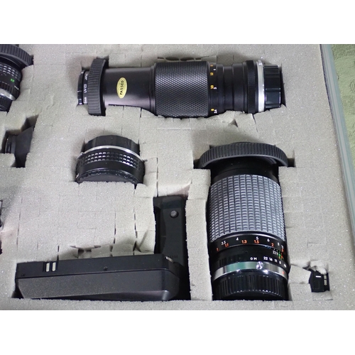 460 - An Olympus OM10 35mm Camera Outfit including various lenses, motor drive, flash in a hard case and a... 