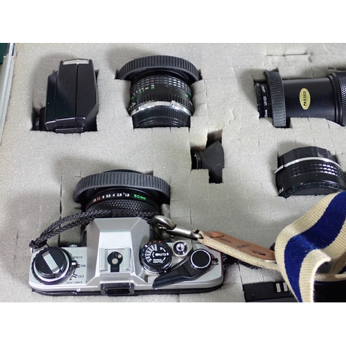 460 - An Olympus OM10 35mm Camera Outfit including various lenses, motor drive, flash in a hard case and a... 